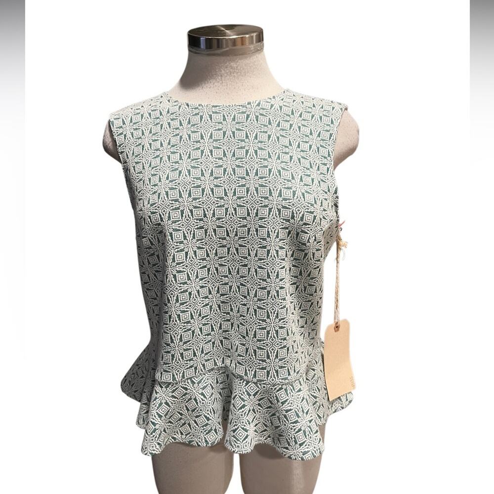 Sunday In Brooklyn Peplum top with a geometric pattern  
Fits like a Small NWT